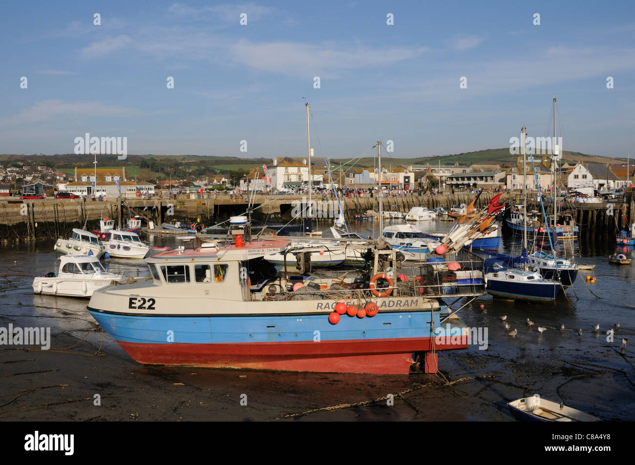 West Bay Dorset England UK a seaside resort on the Jurassic Coast The old harbour at low tide Stock Photo