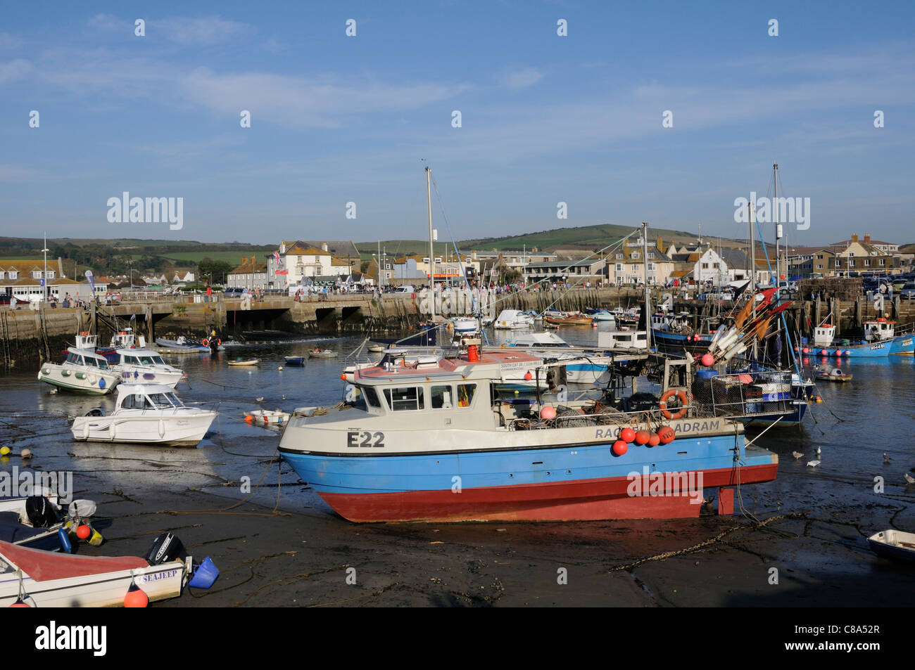 West Bay Dorset England UK a seaside resort on the Jurassic Coast The old harbour at low tide Stock Photo
