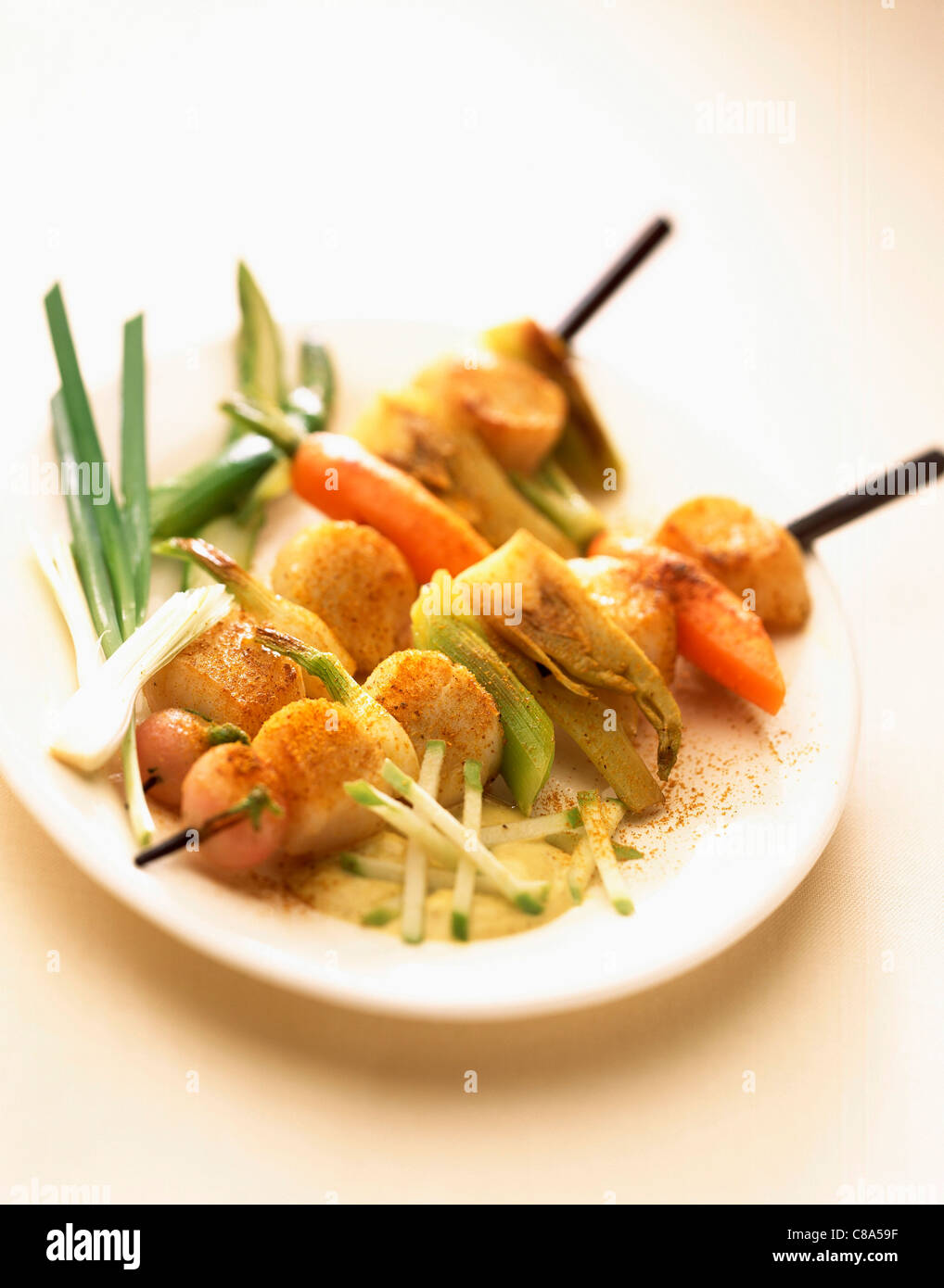 Seafood kebabs with vegetable and curry sauce Stock Photo Alamy