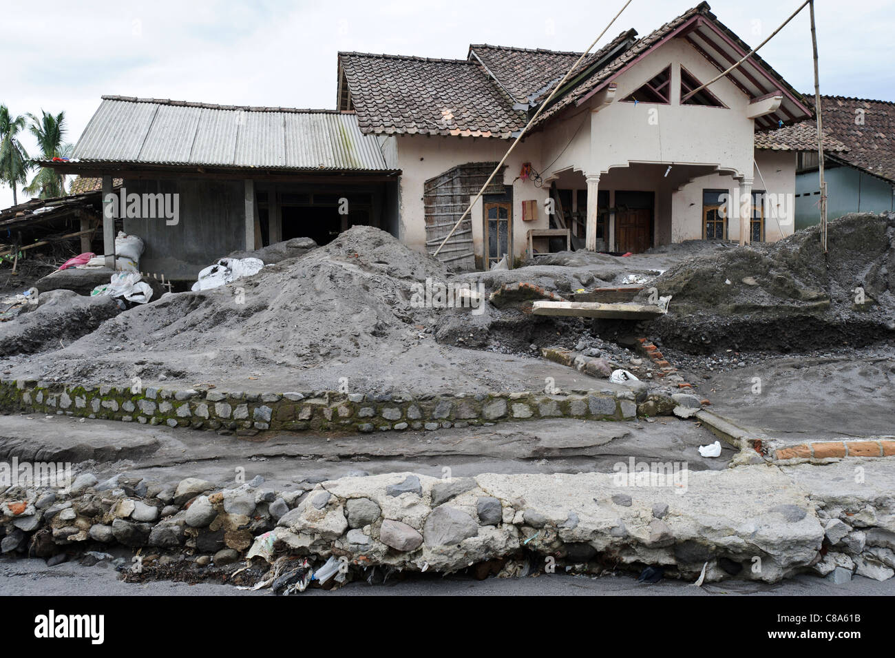 A house badly damaged by a lahar mud flow in March 2011, Sirahan, Magelang, Yogyakarta, Java, Indonesia. Stock Photo