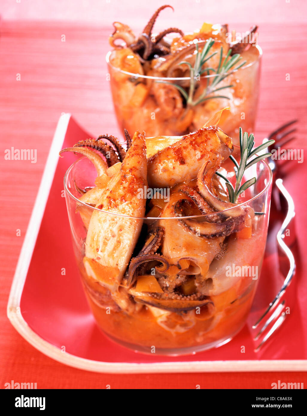 Squid in tomato sauce Stock Photo - Alamy