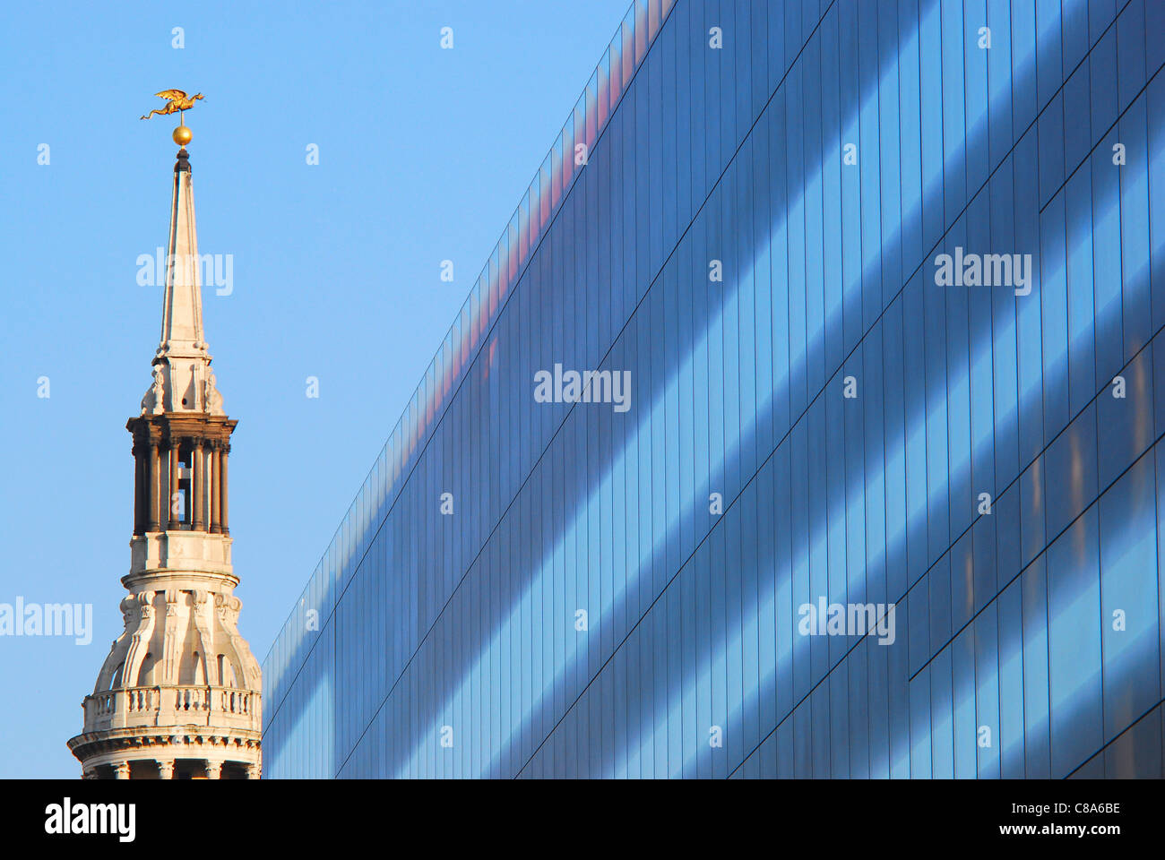 The ultra-modern architecture of One New Change building and the old spire of St. Mary-le-Bow, in Cheapside, London, UK. Stock Photo