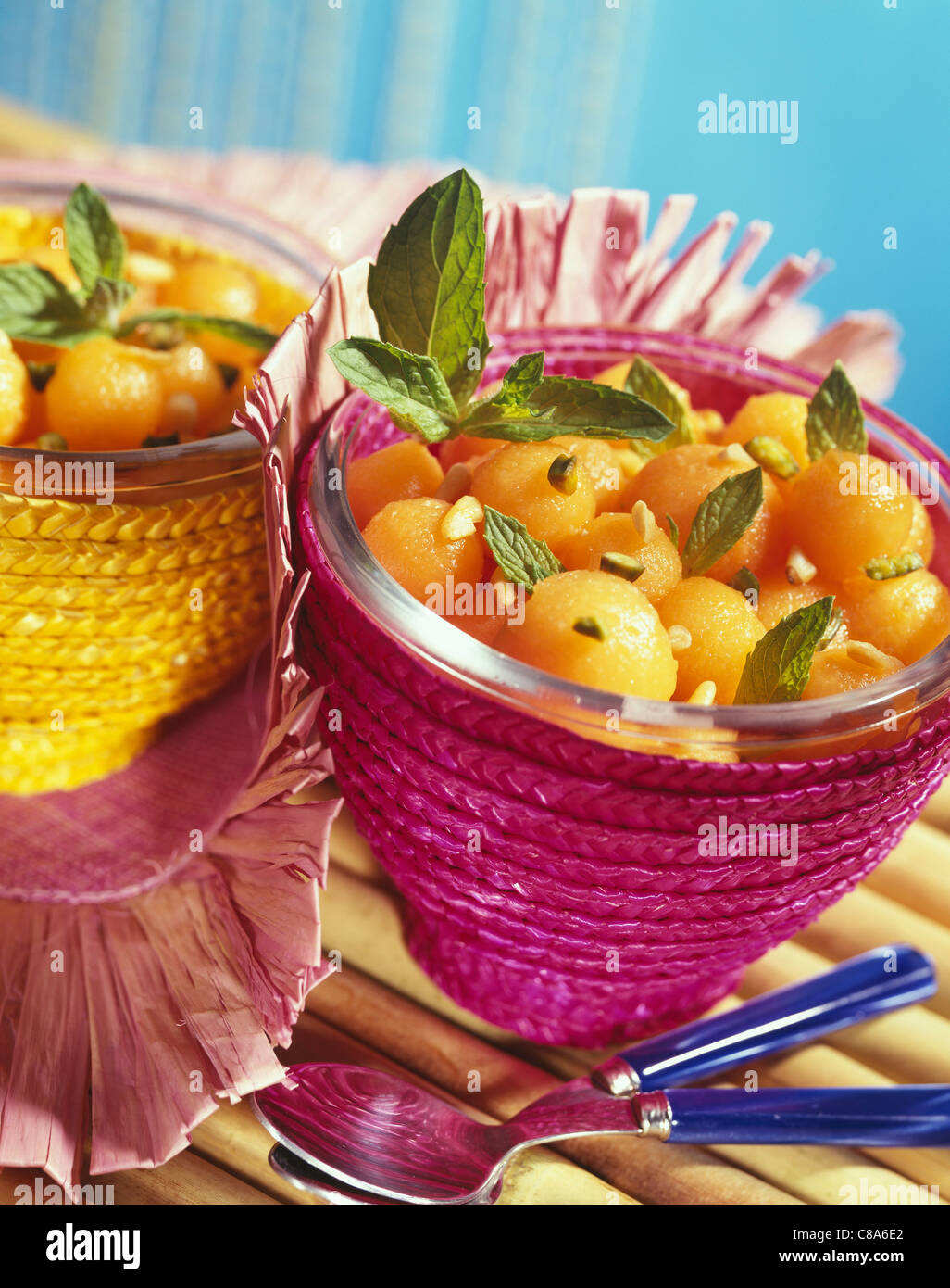 Juicy melon balls with pistachios and mint Stock Photo Alamy