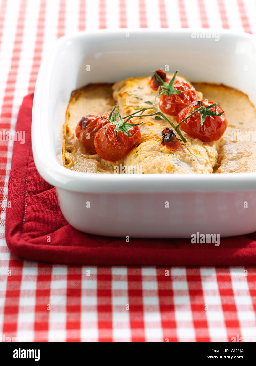 Fresh haddock with cherry tomato pesto Stock Photo Alamy