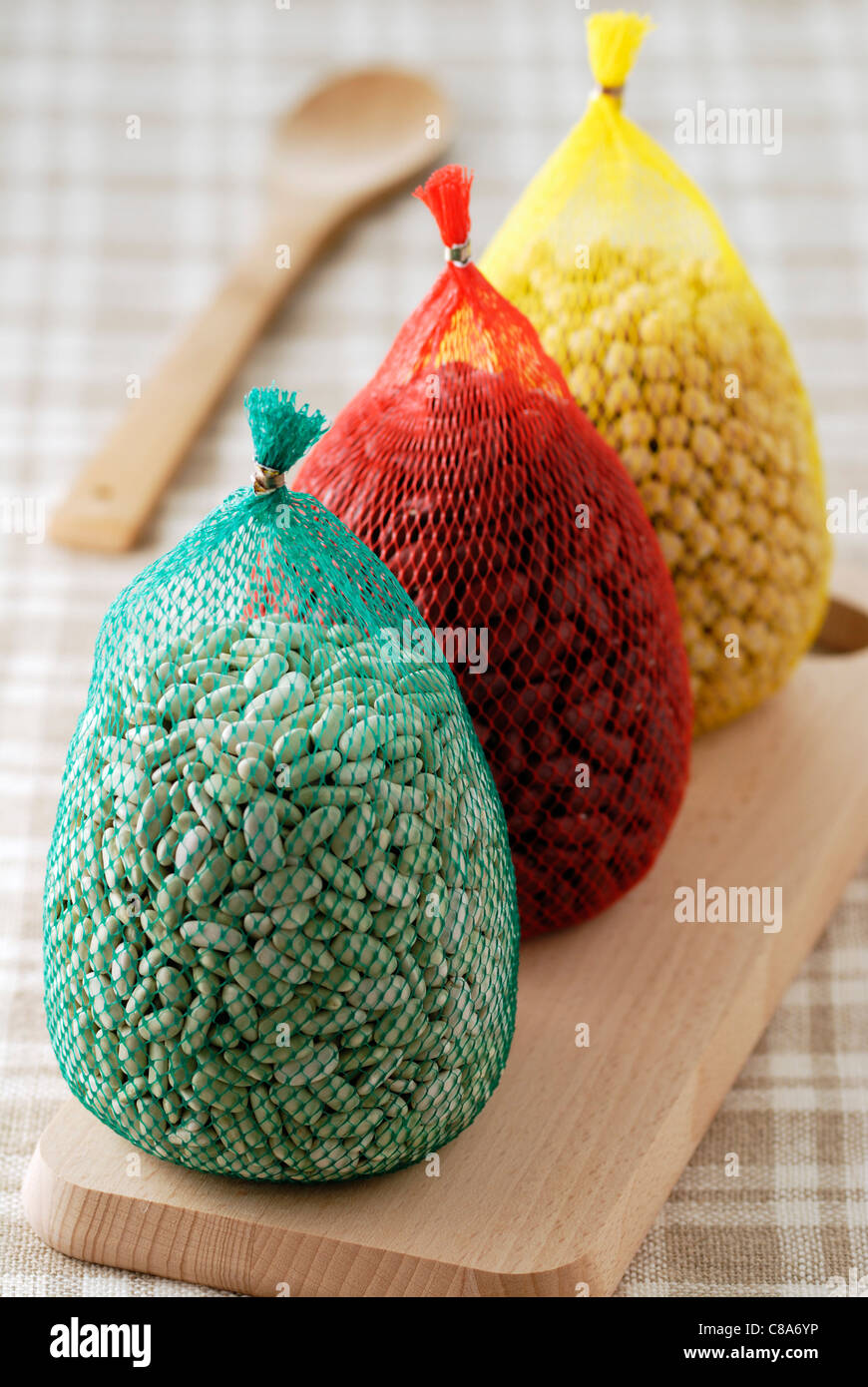 Three string bags of dried vegetables Stock Photo Alamy