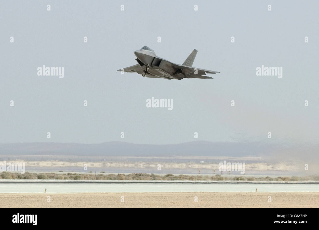 An F-22 Raptor powered by biofuel takes off March 18, 2011, at Edwards Air Force Base, California Stock Photo