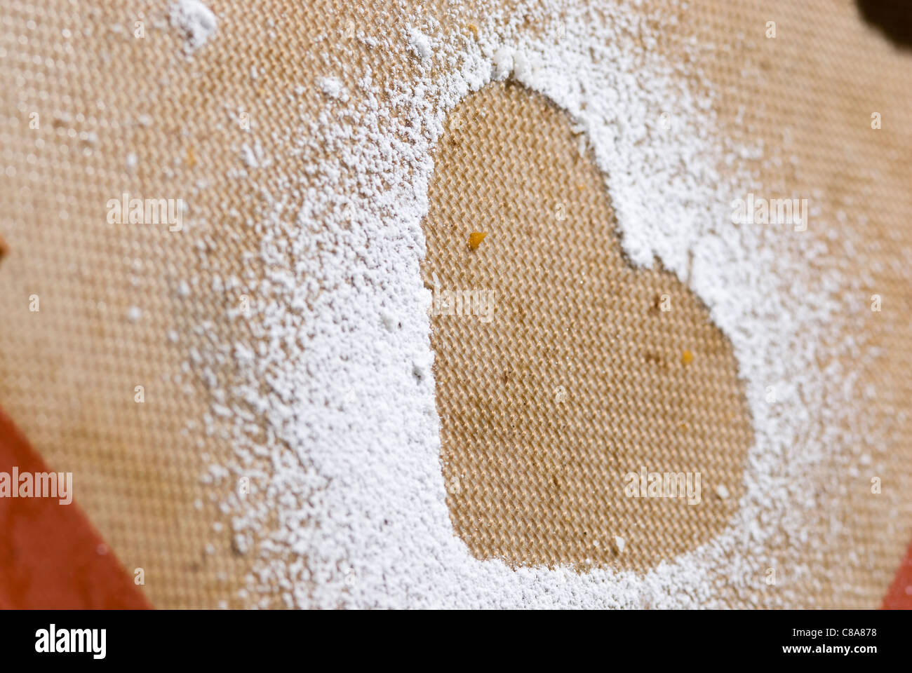 Heart-shaped mark in icing sugar Stock Photo