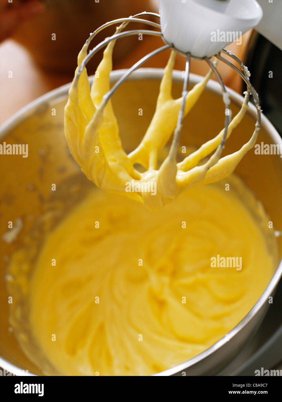 Blending together the egg yolks and the sugar Stock Photo Alamy