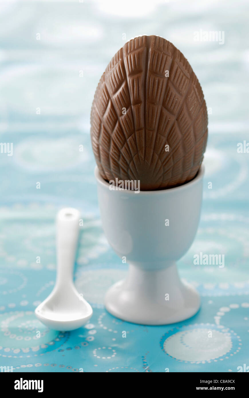 Chocolate egg in eggcup Stock Photo