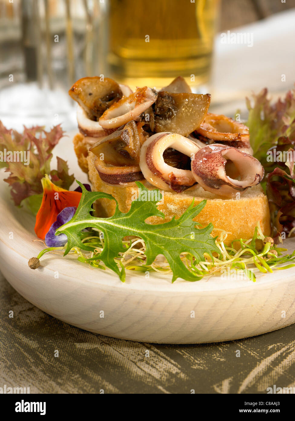 Chipiron and mushroom open sandwich Stock Photo