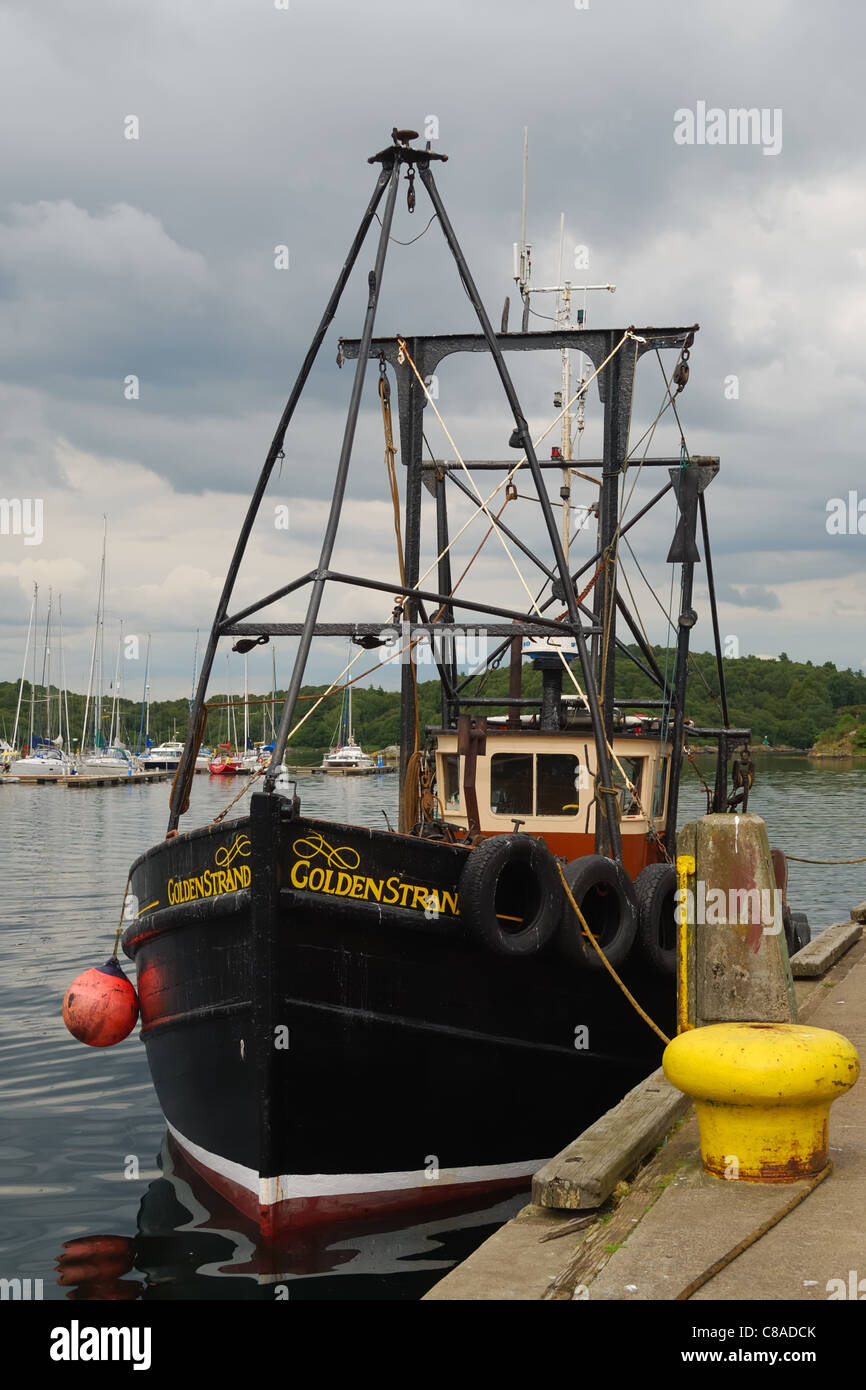 Fishing vessel in the harbour at Tarbert, Scotland, Uk Stock Photo