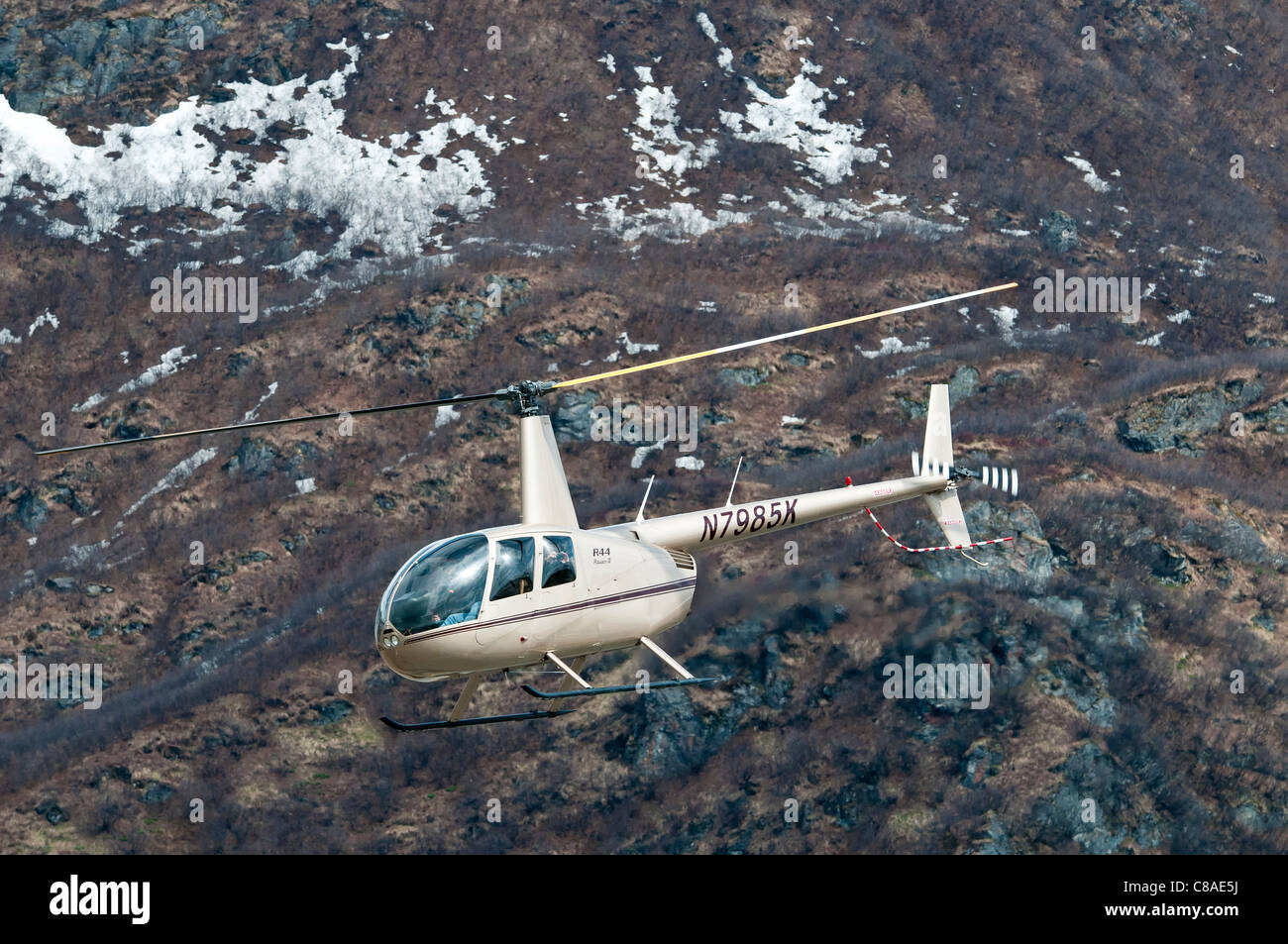 Robinson R44 Raven II helicopter in flight, Valdez Flyin and Air Show