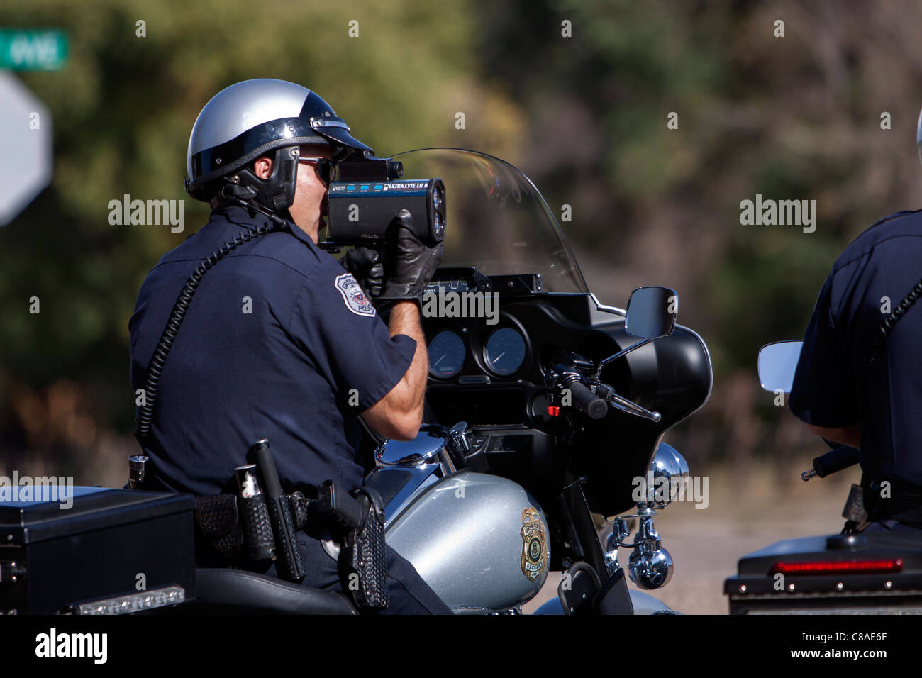 Police officers use radar to check the speed of motorists in Greely, Colorado, USA, 10/3/11. Stock Photo