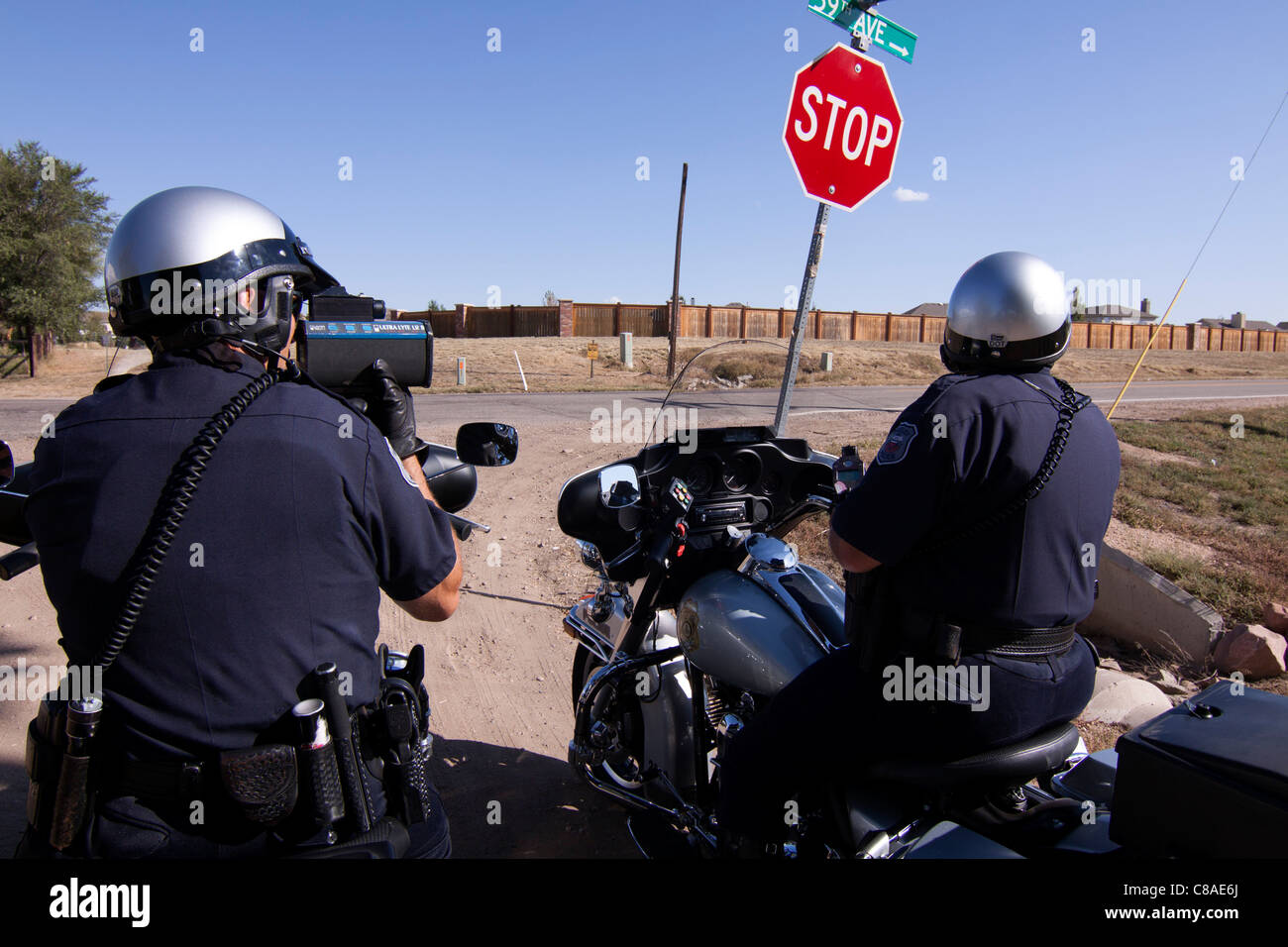 Police officers use radar to check the speed of motorists in Greely, Colorado, USA, 10/3/11. Stock Photo