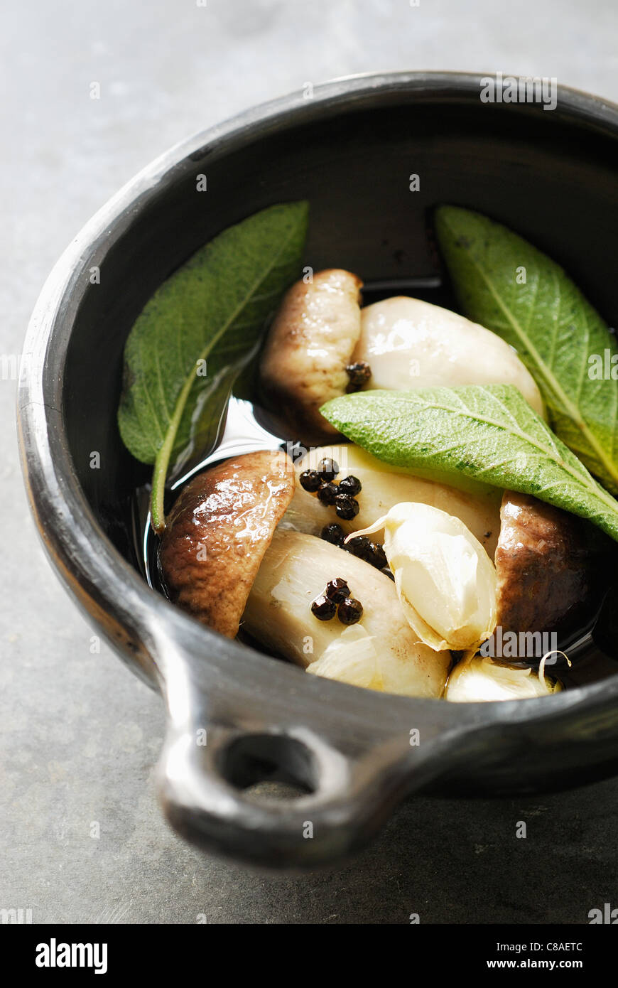 Cep Fricassée with sage and confit garlic Stock Photo