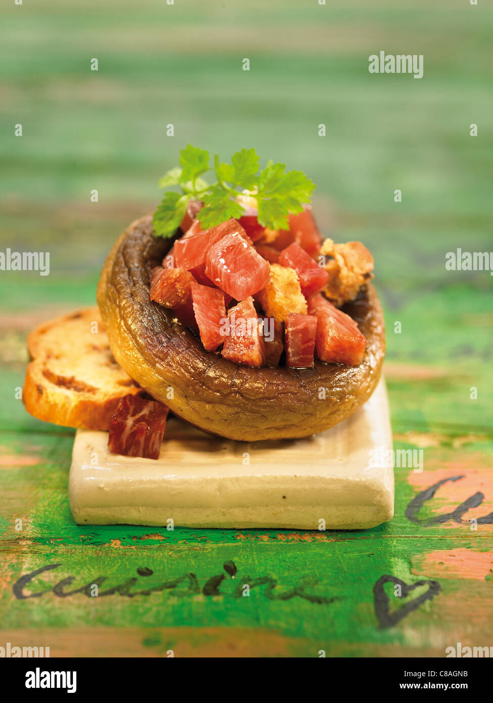 Mushroom tops filled with diced ham Stock Photo