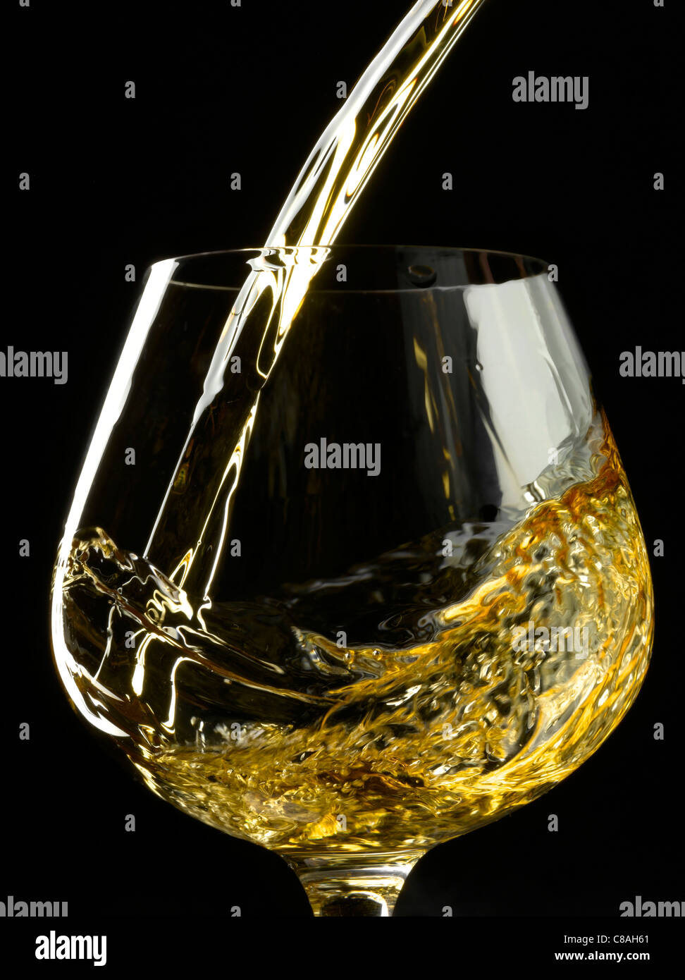 Pouring a glass of white wine Stock Photo Alamy