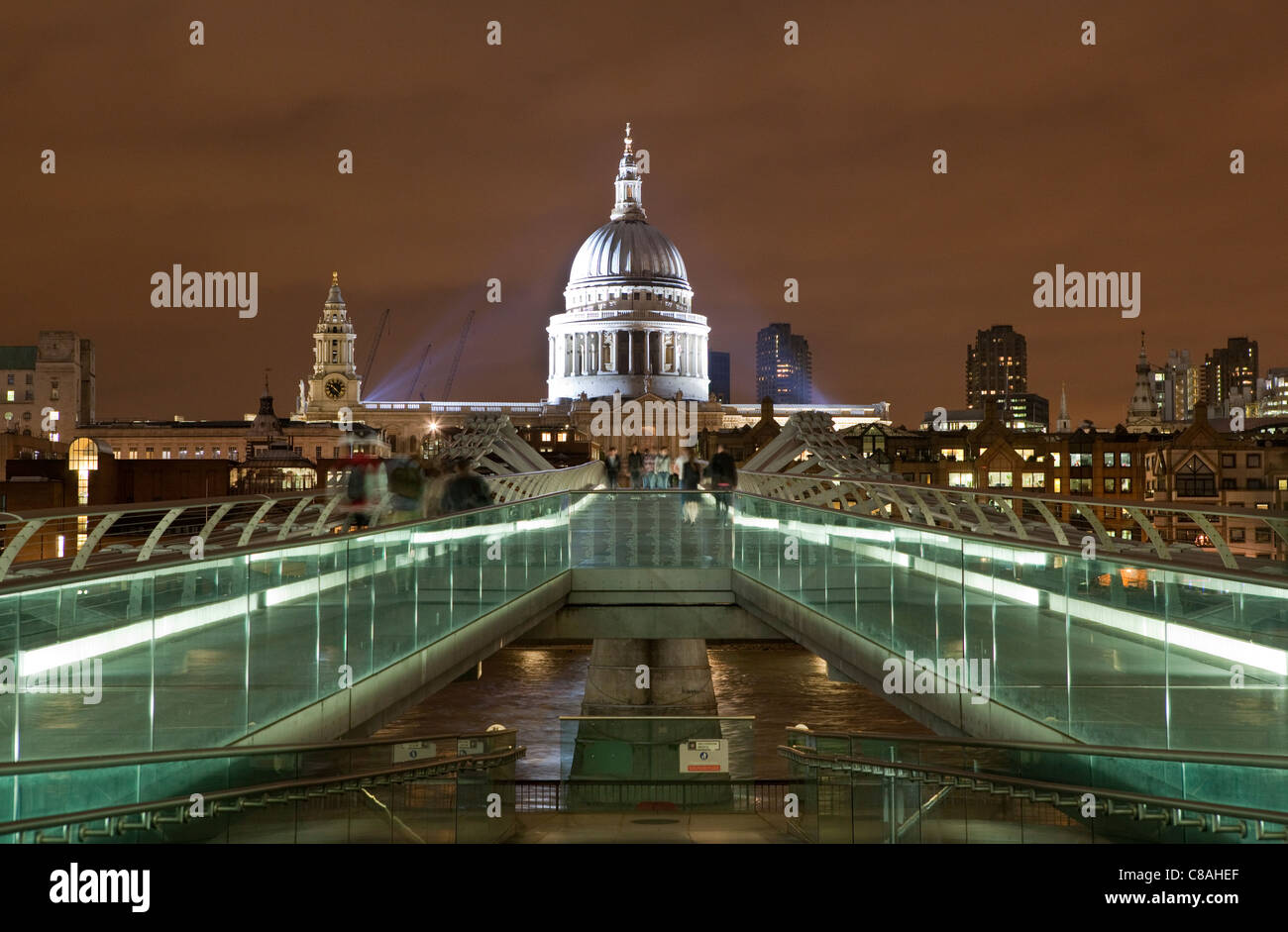 The Millennium Foot Bridge in London at night. St Paul's Cathedral. Stock Photo