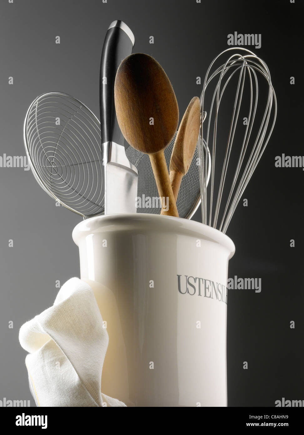 Cooking implements in a pot Stock Photo - Alamy