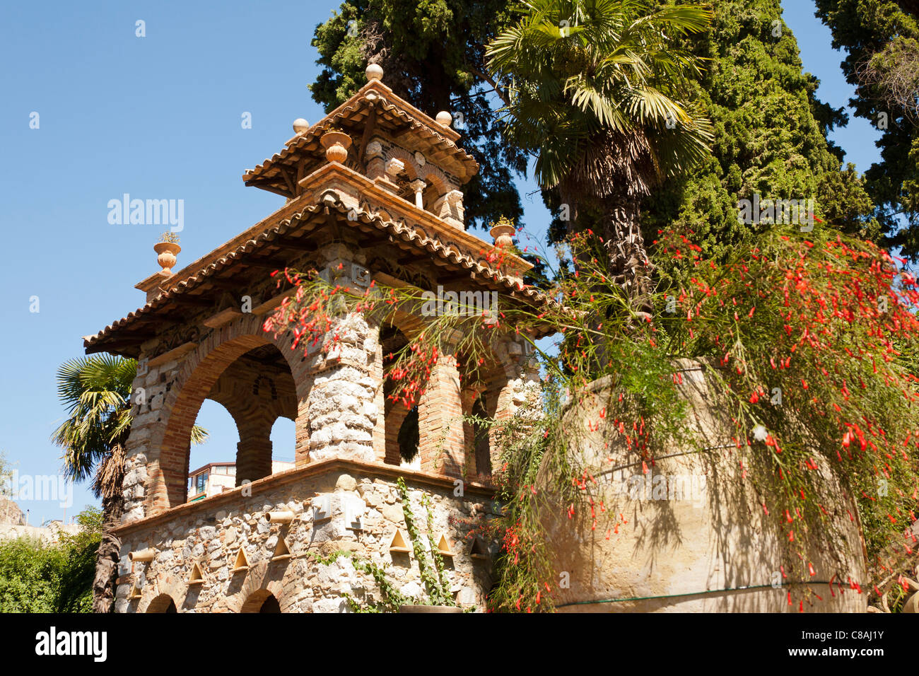 A building in Trevelyan Public Gardens, Villa Comunale, Via Bagnoli Croce, Taormina, Sicily, Italy Stock Photo