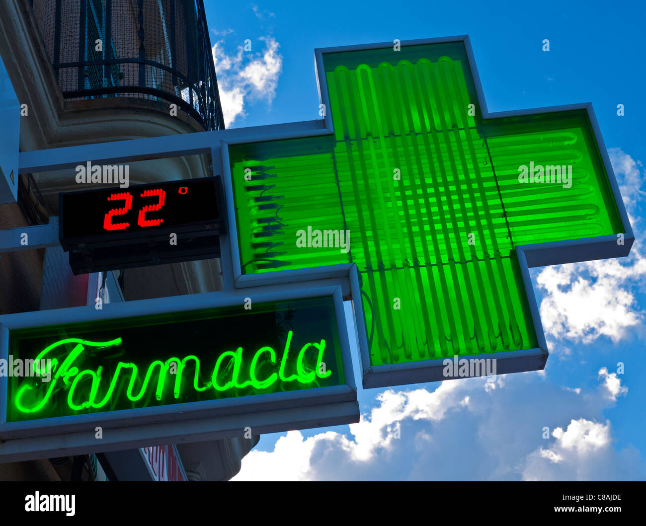 Spanish 'Farmacia' green cross sign showing 22C outside chemist pharmacy shop in Palma Mallorca Spain Stock Photo