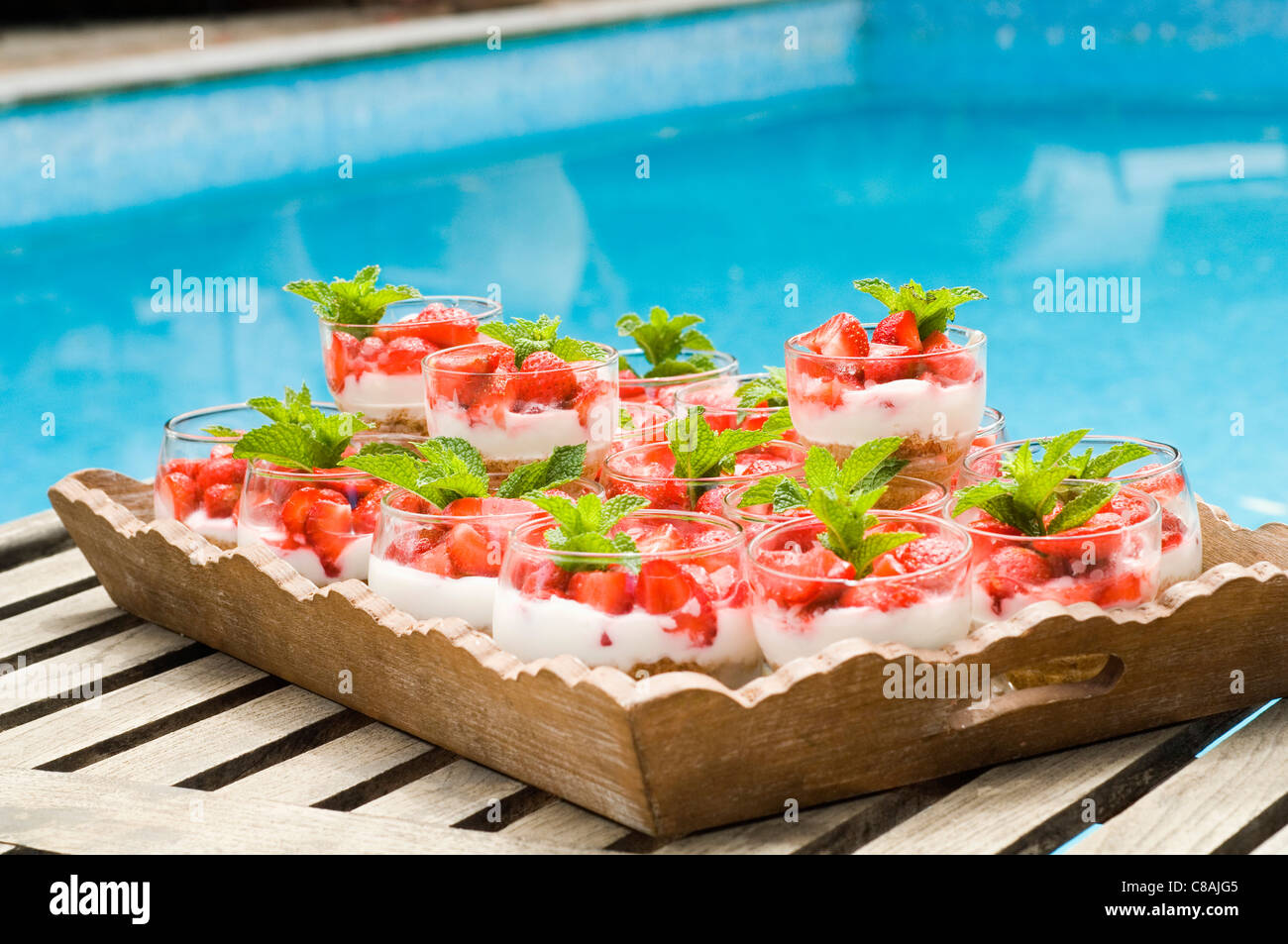 Verrines of fromage blanc with strawberries on platter Stock Photo - Alamy