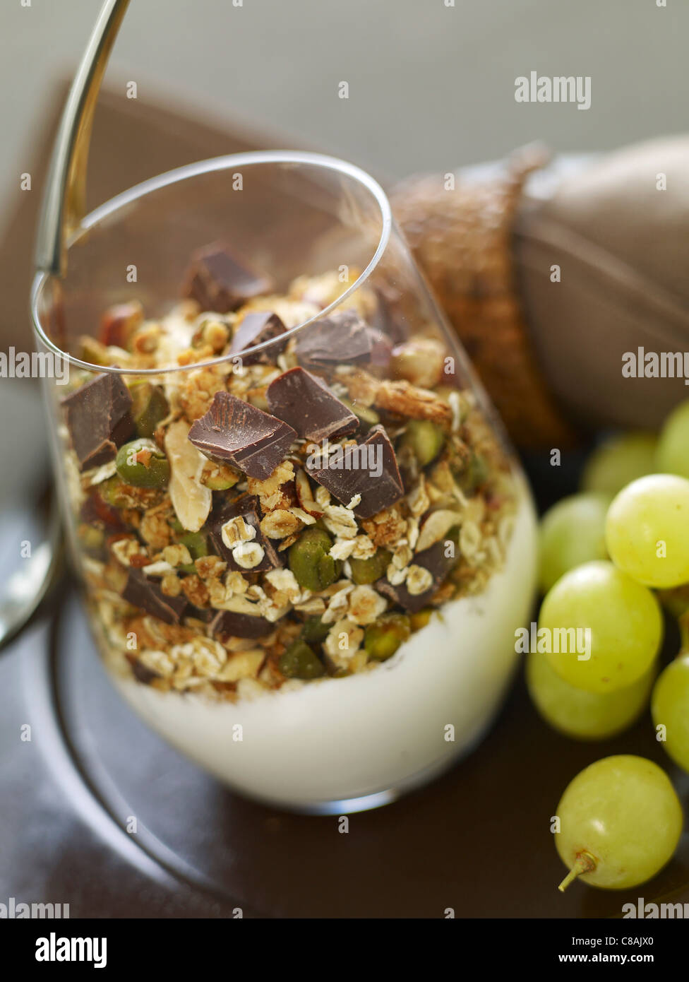 Yoghurt with cereals,dried fruit and chocolate chips Stock Photo Alamy