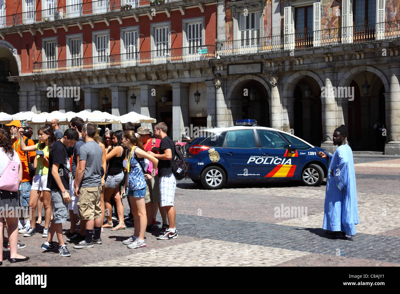 Student tour group and police car in Plaza Mayor , Madrid , Spain Stock Photo