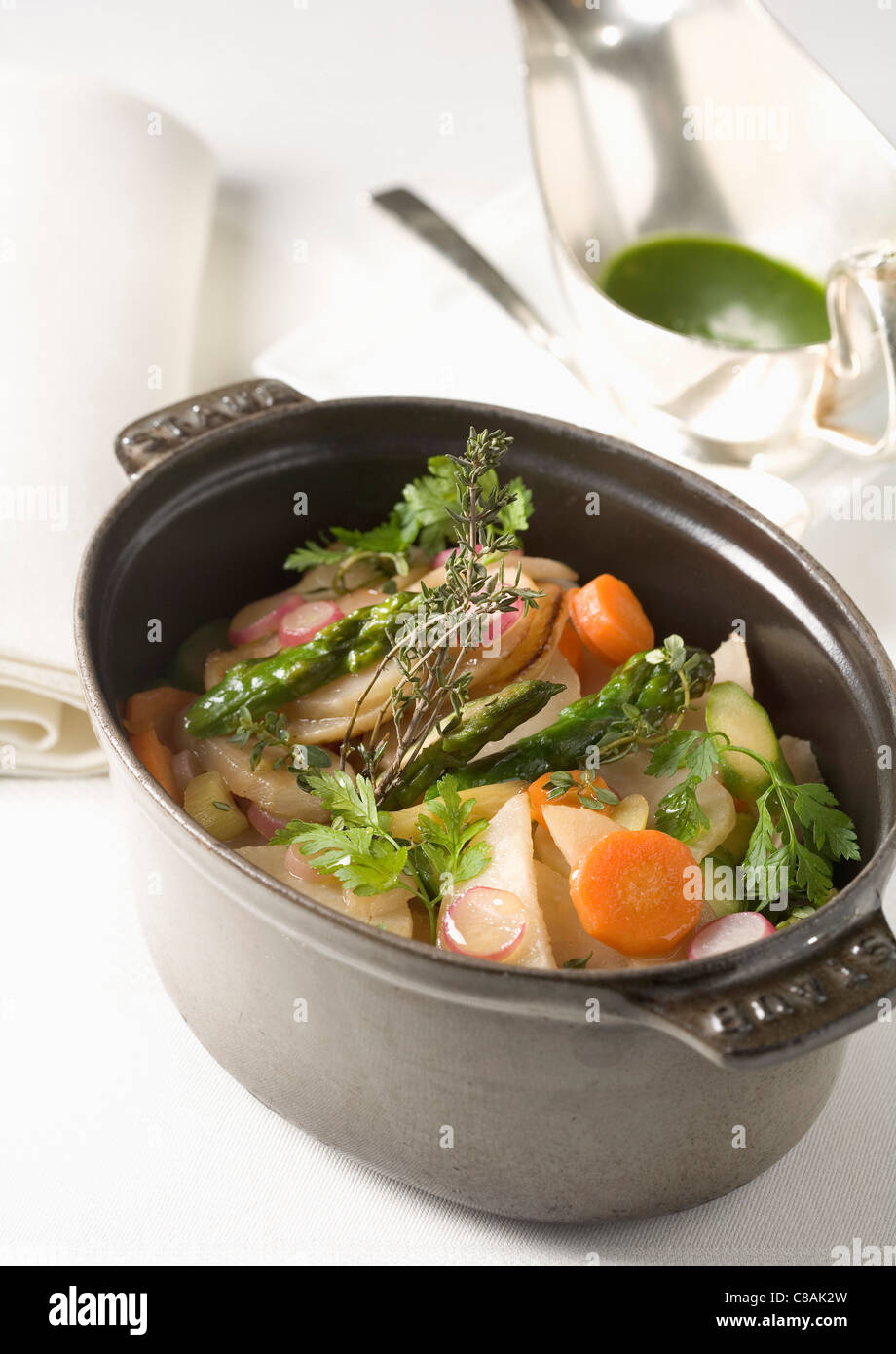 Casserole dish of vegetables with herbs Stock Photo