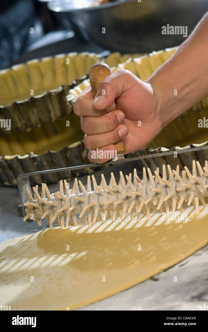 Rolling pin for pricking the pastry Stock Photo