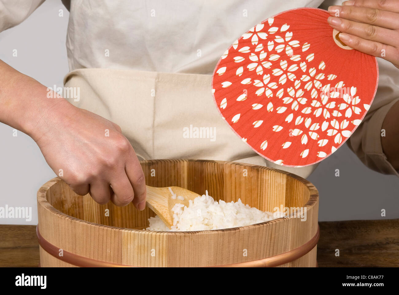 Cook preparing Japanese sticky rice Stock Photo