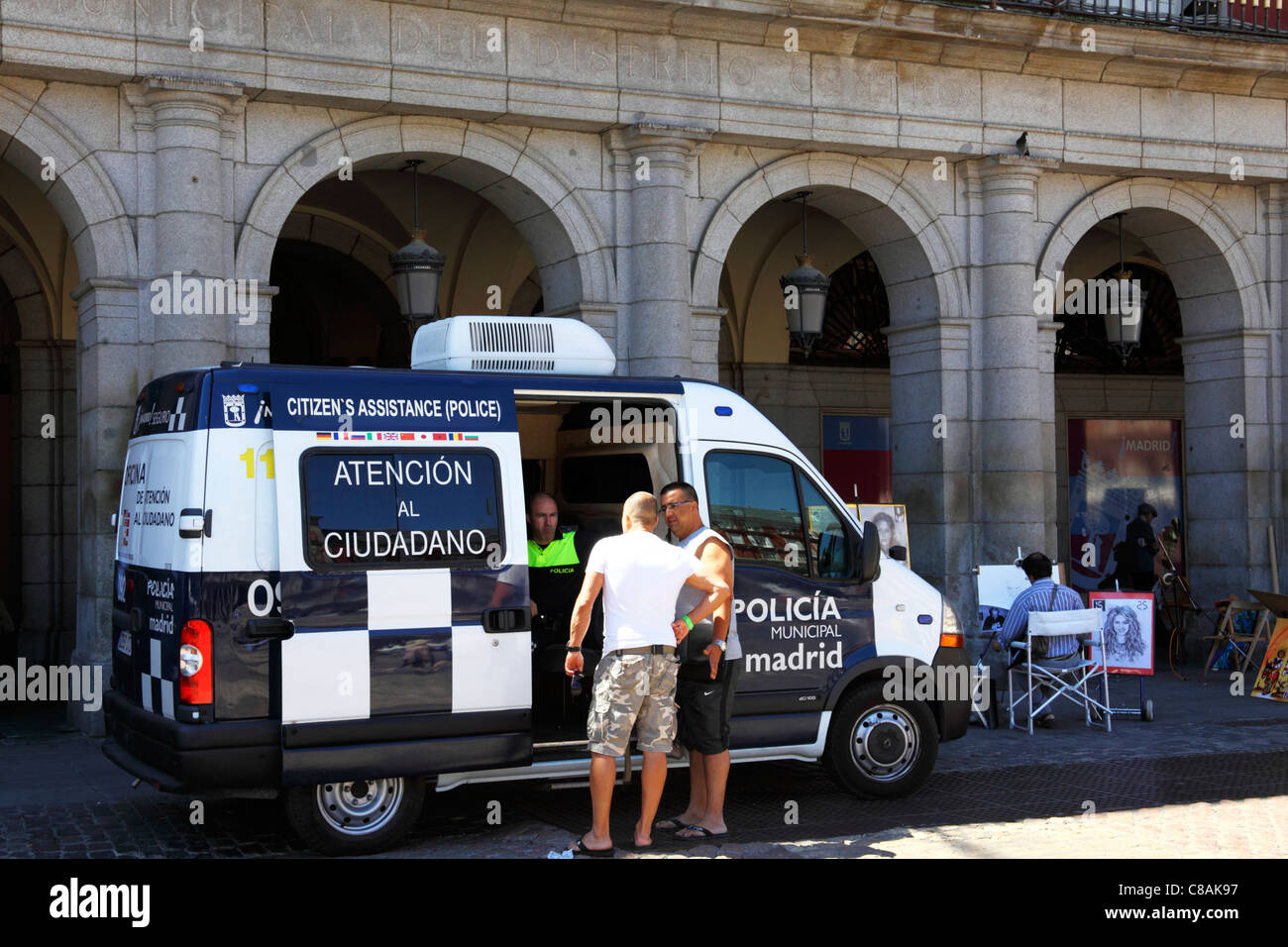 Citizens Assistance police van helping tourists in Plaza Mayor , Madrid , Spain Stock Photo