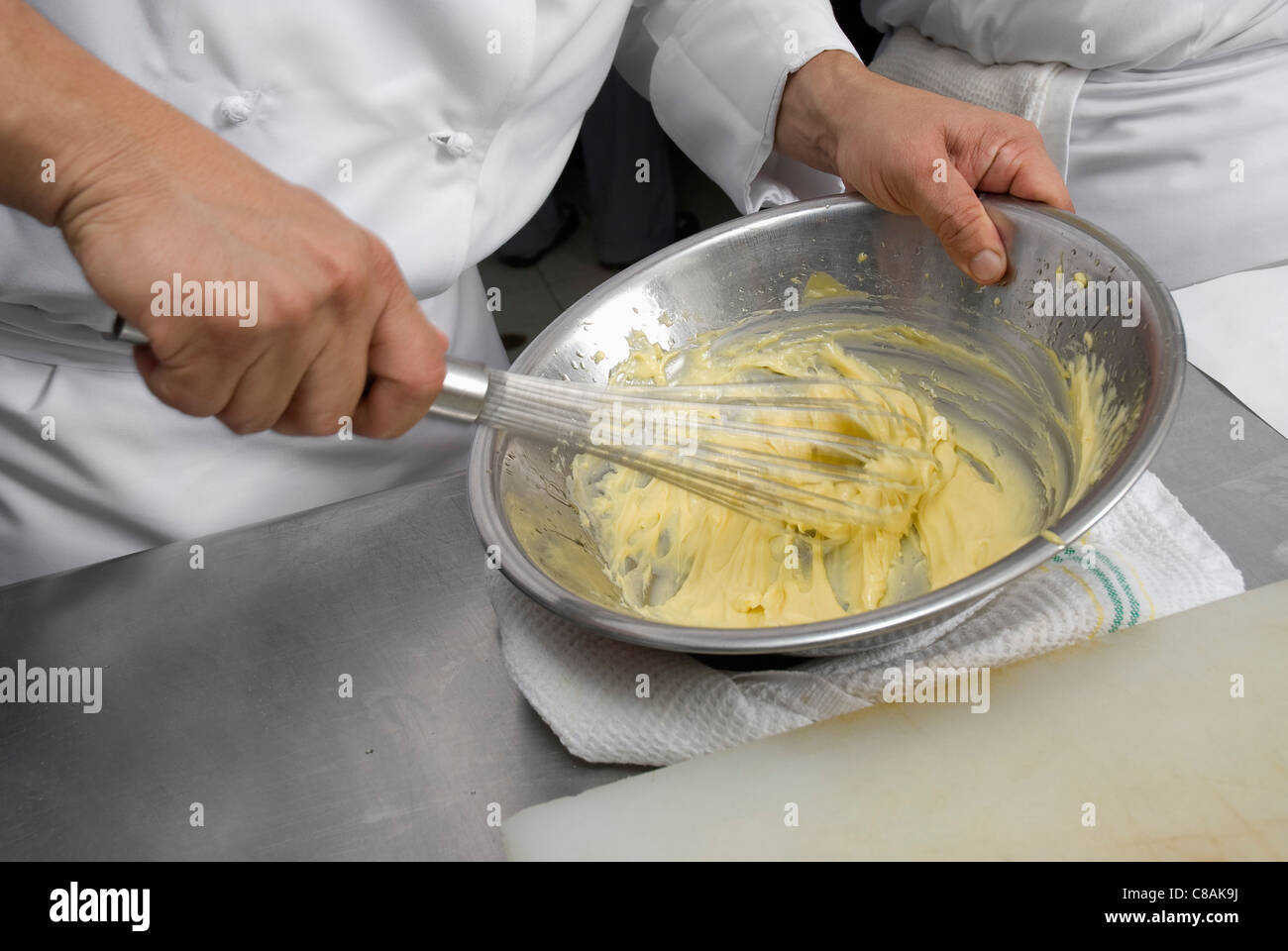 Cook whipping a preparation Stock Photo