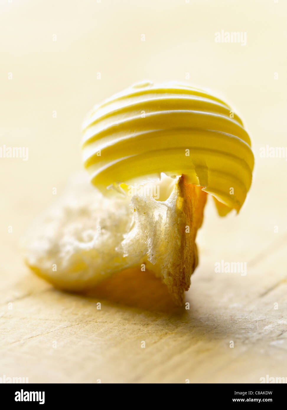 Knob of butter on a piece of bread Stock Photo Alamy