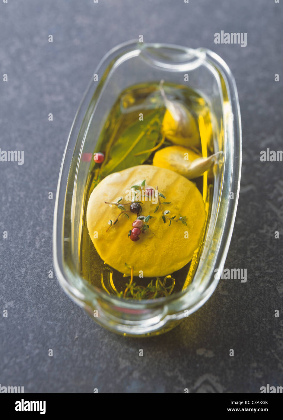Rocamadour cheese marinated in oil,pepper and thyme Stock Photo