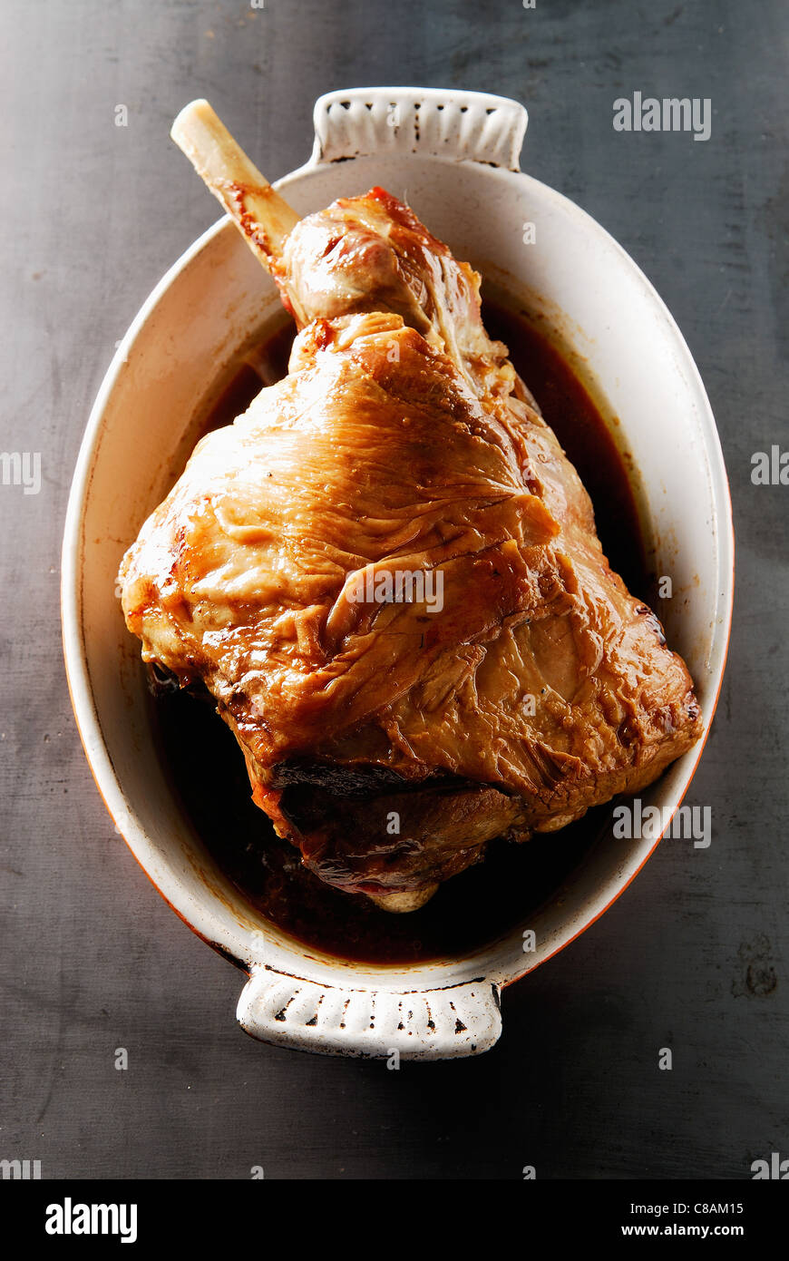 Poched and then roasted leg of lamb with spices Stock Photo Alamy
