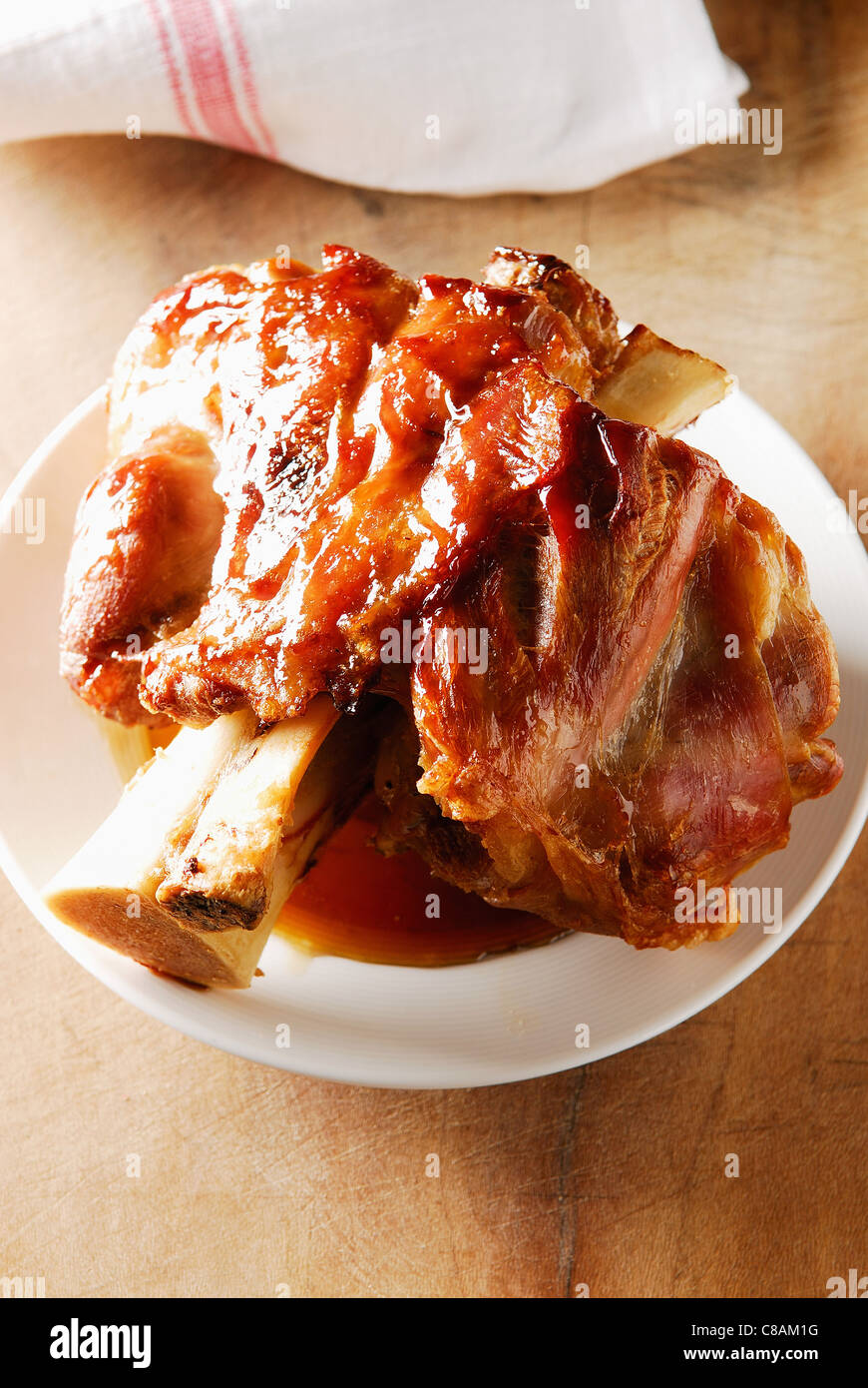 Confit knuckle of veal roast in a casserole dish Stock Photo