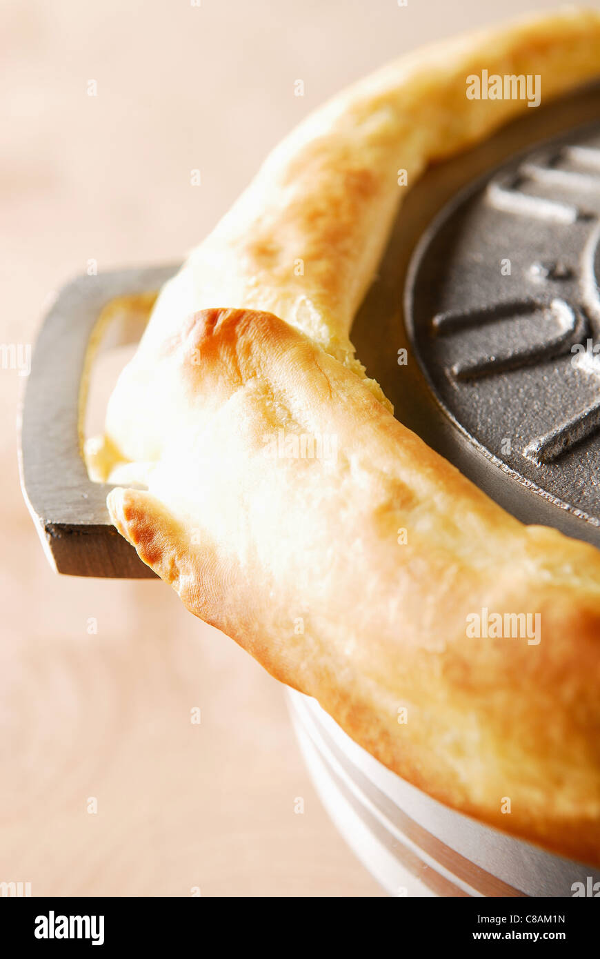 Beef stew in casserole dish sealed with dough Stock Photo