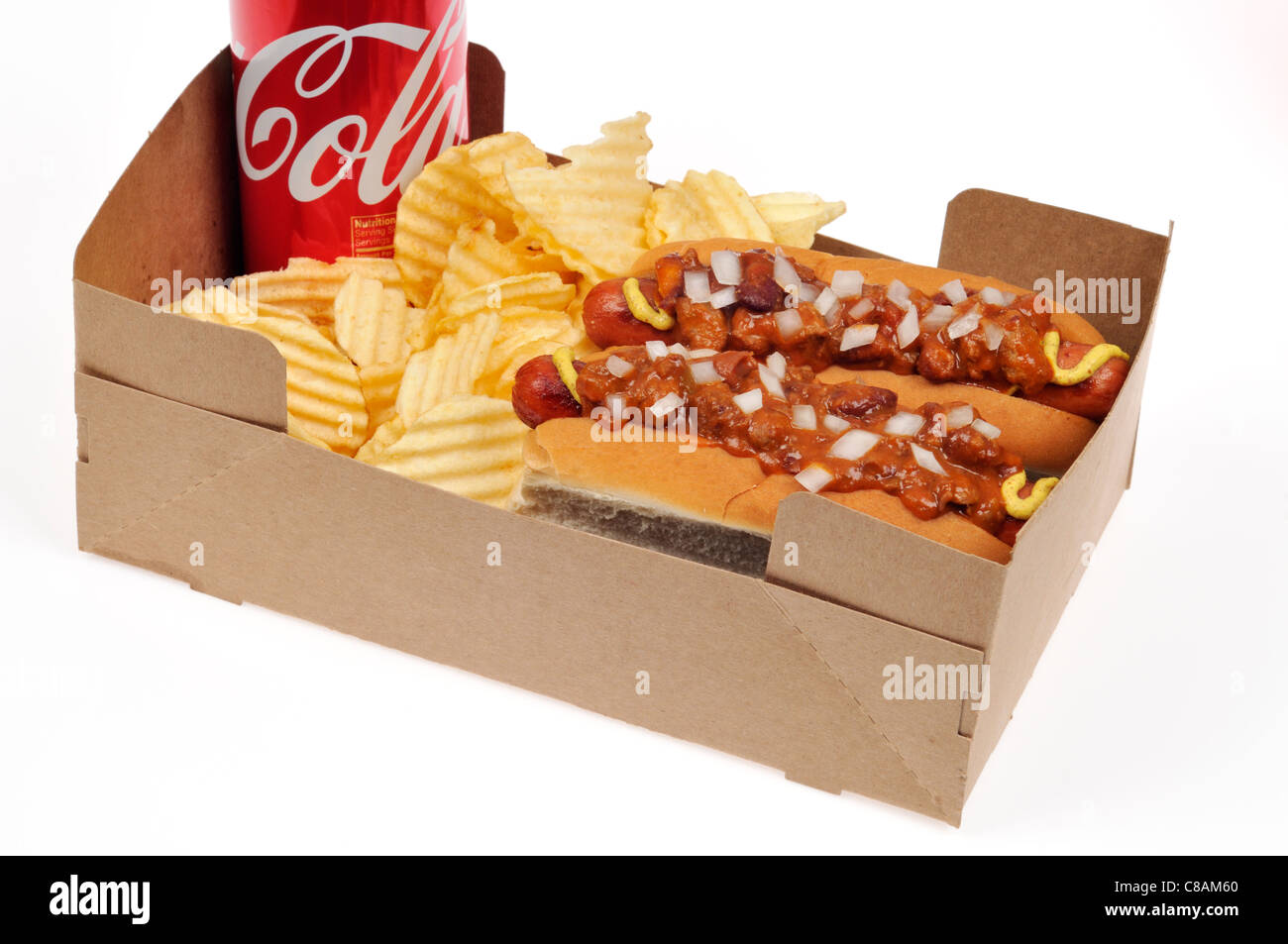 2 take-out Chili dogs with onions in bread rolls with a tin of coke and crisps on white background. Stock Photo