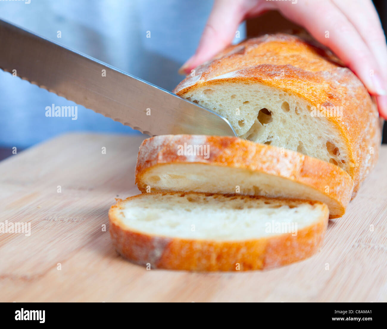 Slicing bread Stock Photo