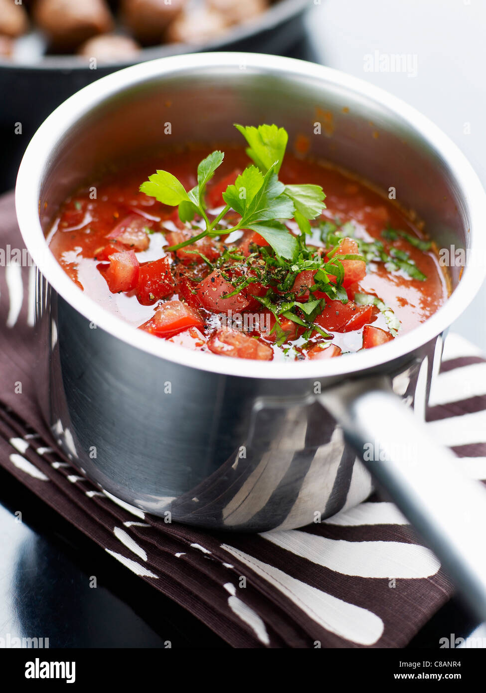 Making fresh tomato sauce with herbs Stock Photo Alamy