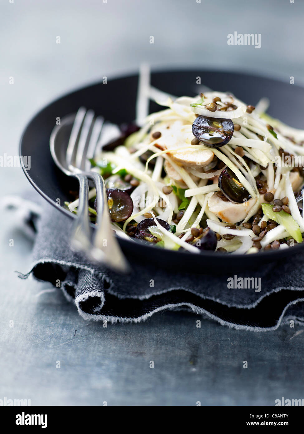 Chicken,lentil,white cabbage and black grape salad Stock Photo