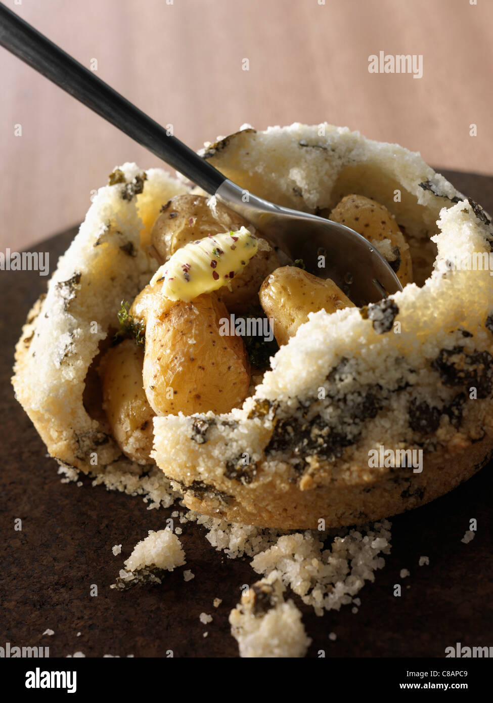 Potatoes cooked in salt crust Stock Photo