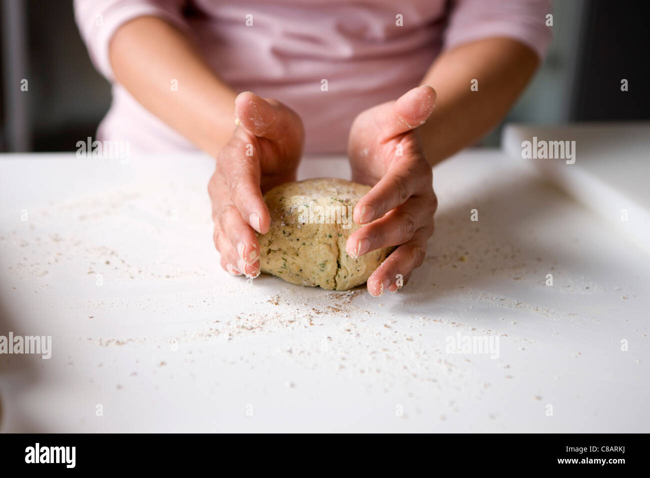 Shaping the soya bean mixture into a ball with your hands Stock Photo
