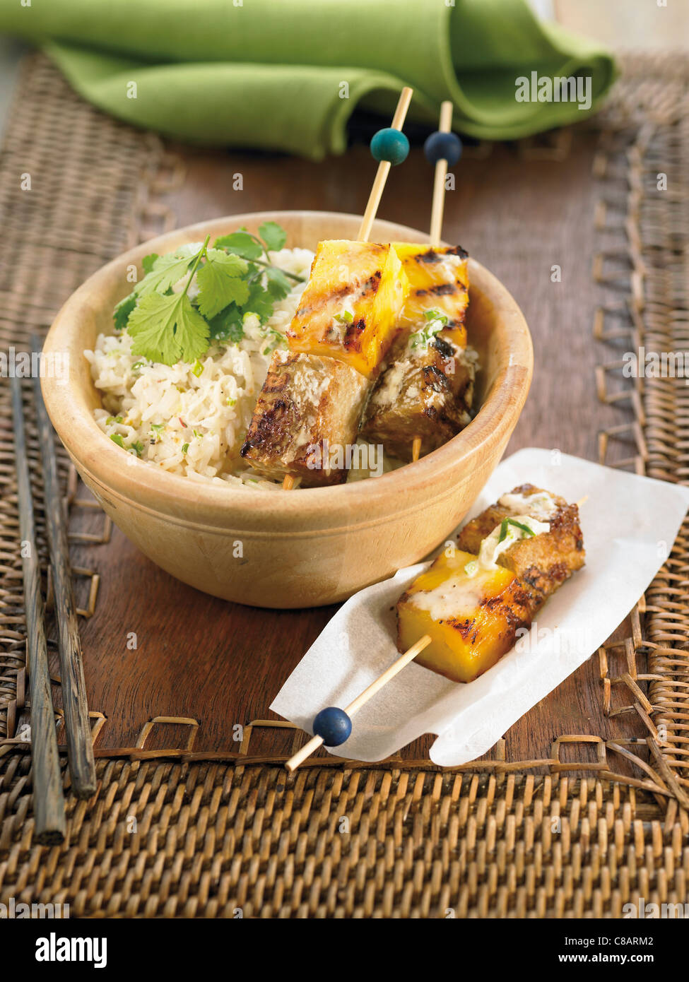 Seitan and pineapple brochettes with basmati rice Stock Photo