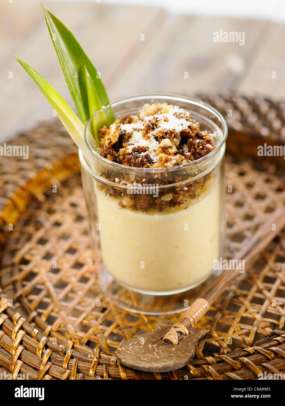 Pineapple and soya cream mousse with crumbled wholemeal cookie topping Stock Photo