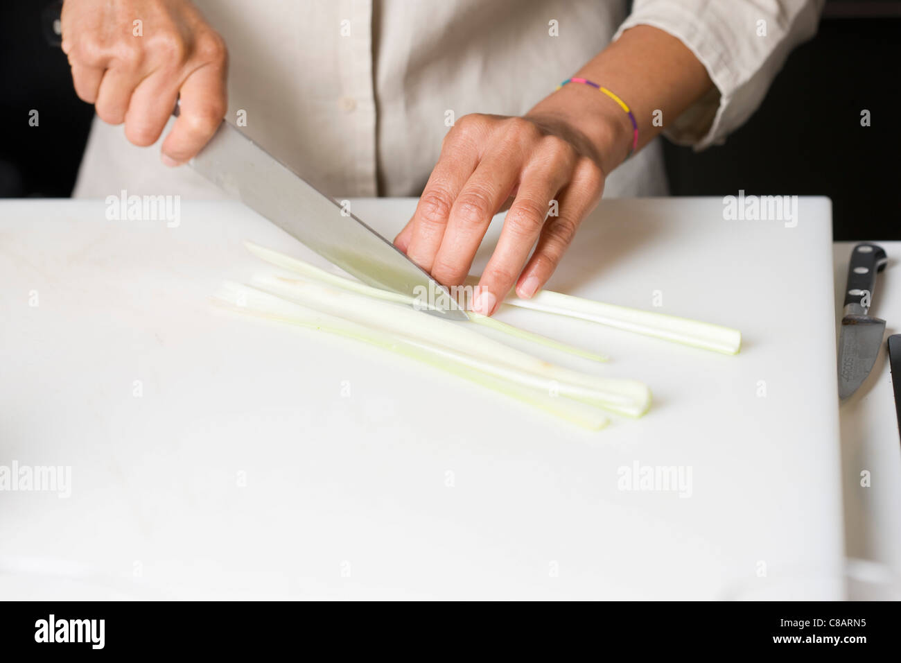 Slicing the celery stalks Stock Photo