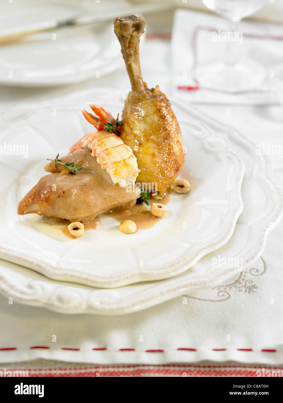 Chicken with pig's trotters,Dublin Bay prawns and hazelnuts Stock Photo
