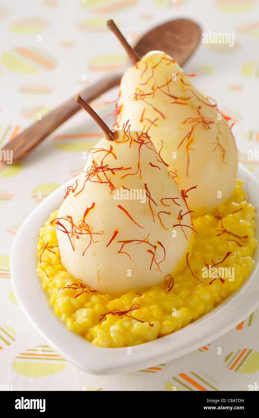 Saffron-flavored rice pudding with stewed pears Stock Photo