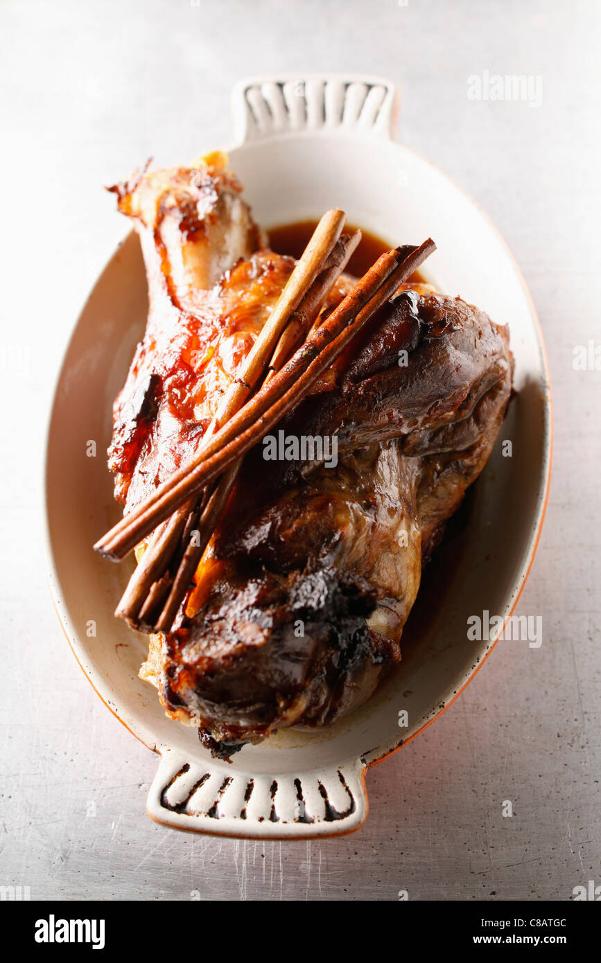 Roast knuckle of pork with cinnamon Stock Photo